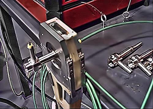 Side-by-side comparison of stainless steel grade labels (304, 316, 2205) on metal sheets in a warehouse setting