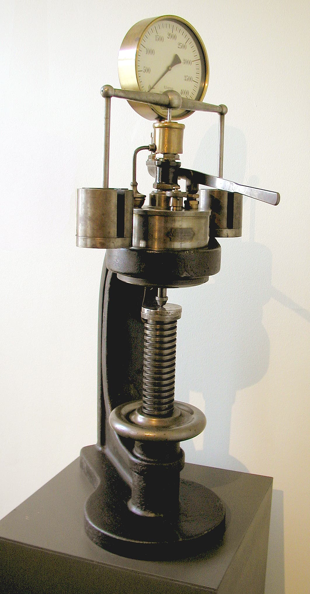 Close-up of stainless steel parts undergoing nitric acid passivation in an industrial tank