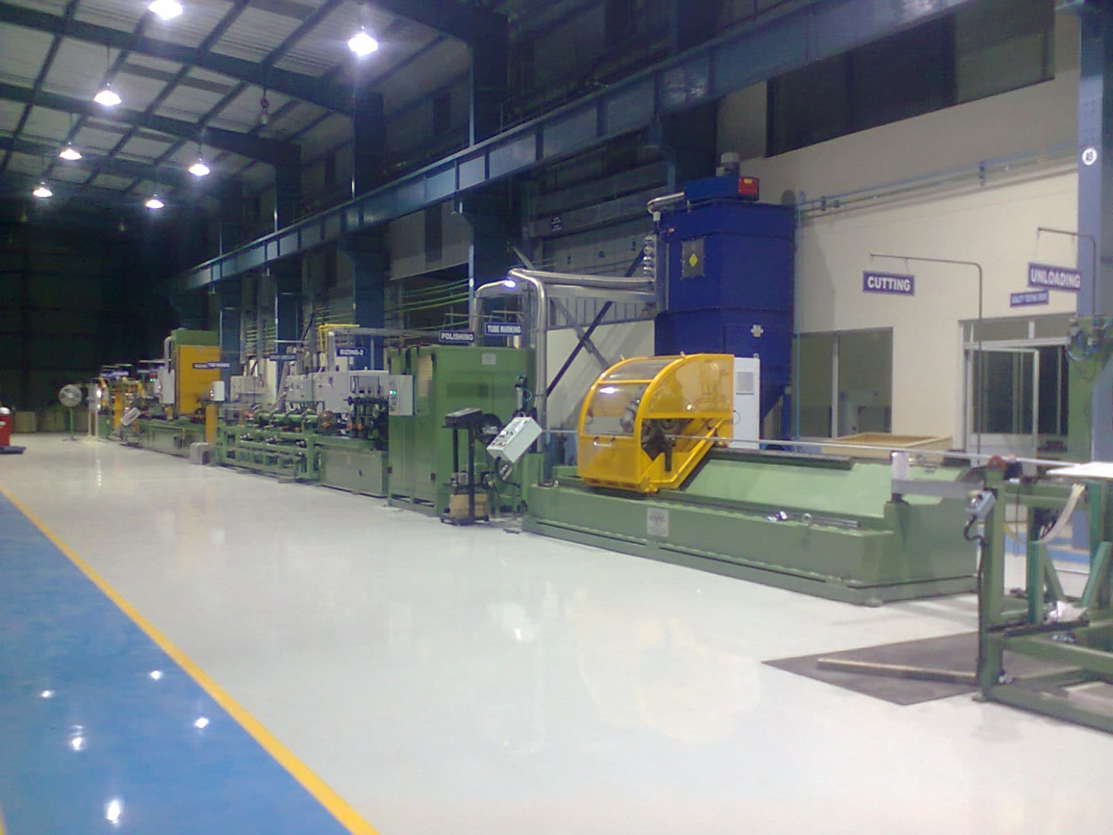 Precision stainless steel parts on a calibrated surface plate with calipers and micrometers